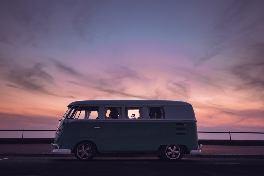 Image of Campervan on a beach at sunset